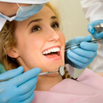 girl smiling with her mouth open during dental exam
