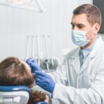 dentist examining patients tooth