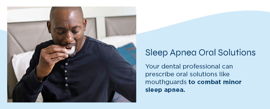sleep apnea oral solutions man placing mouth guard in mouth
